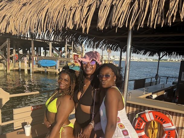 Three girls on party boat at Gulf Coast, Houston, Texas