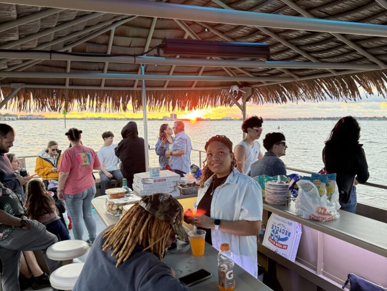 People had a great time on a party boat of Gulf Coast Party Boats at Gulf Coast, Houston, Texas. Sunset on the background.