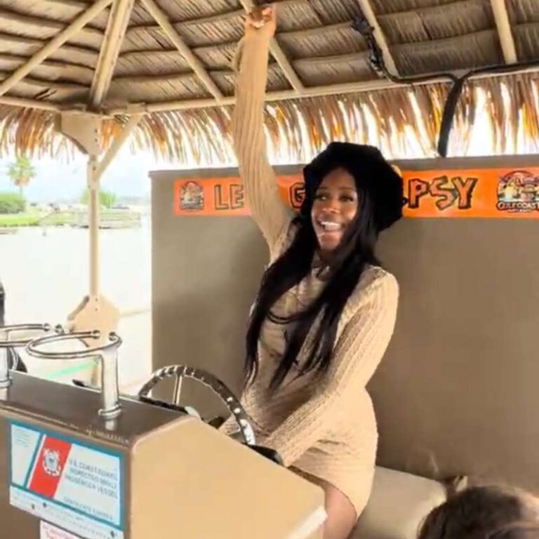 A girl being a DJ on her graduation party hosted on Gulf Coast Party Boats at Gulf Coast, Houston, Texas