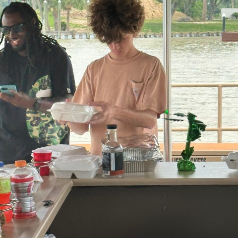 a group of people sitting at a table drinking wine