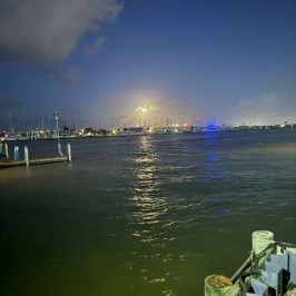 a boat sitting next to a body of water