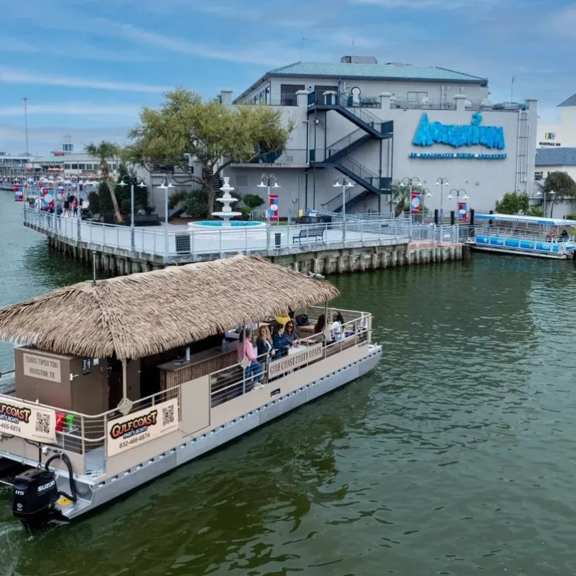 a boat is docked next to a body of water
