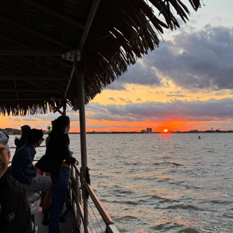 a group of people on a boat in the water