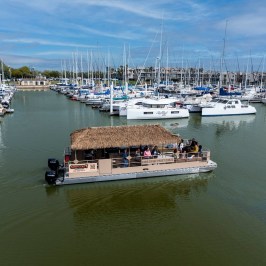 a boat is docked next to a body of water